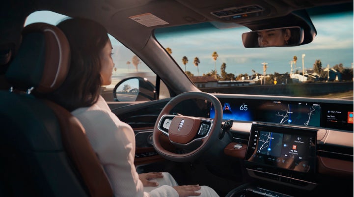 A person is shown driving hands-free on the highway with available Lincoln BlueCruise technology. | Parks Lincoln of Gainesville in Gainesville FL