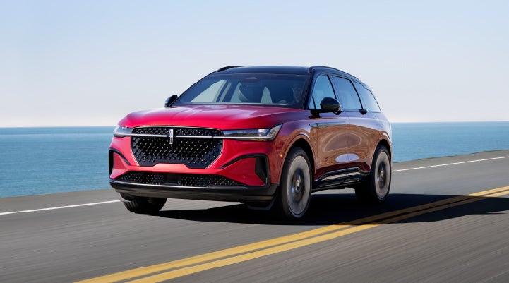 A 2024 Lincoln Nautilus® SUV is being driven on a seaside roadway. | Parks Lincoln of Gainesville in Gainesville FL