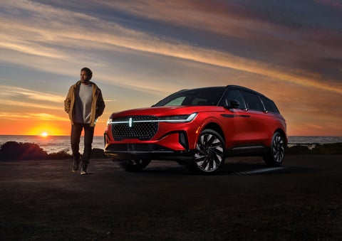 A person is shown next to a 2024 Lincoln Nautilus® SUV as the Lincoln Embrace sequence takes place. | Parks Lincoln of Gainesville in Gainesville FL