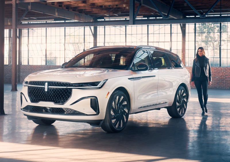 A person approaches a 2024 Lincoln Nautilus® SUV. | Parks Lincoln of Gainesville in Gainesville FL