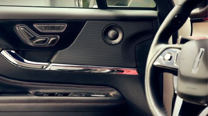 A Revel® audio speaker is shown in the driver's side door of a 2025 Lincoln Corsair® SUV. | Parks Lincoln of Gainesville in Gainesville FL