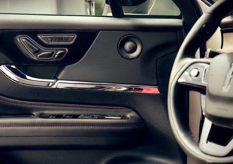 The driver of a 2024 Lincoln Corsair® SUV is shown selecting the drive mode. | Parks Lincoln of Gainesville in Gainesville FL