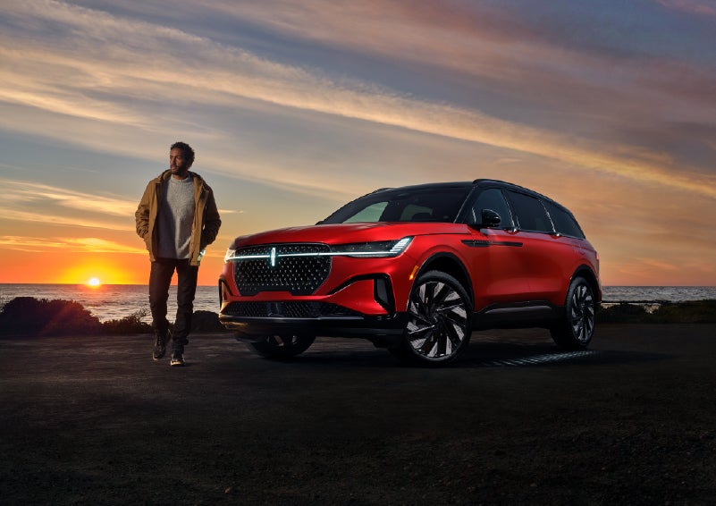 A person is shown next to a 2025 Lincoln Nautilus® SUV as the Lincoln Embrace sequence takes place. | Parks Lincoln of Gainesville in Gainesville FL
