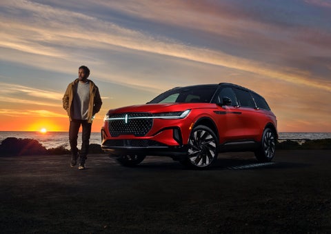 A person is shown next to a 2025 Lincoln Nautilus® SUV as the Lincoln Embrace sequence takes place. | Parks Lincoln of Gainesville in Gainesville FL
