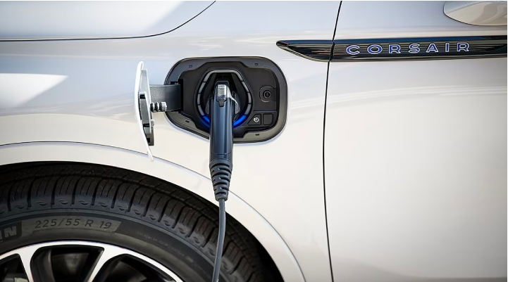 An electric charger is shown plugged into the charging port of a Lincoln Corsair® Grand Touring
model. | Parks Lincoln of Gainesville in Gainesville FL