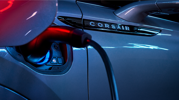 A charger plugged into the charging port of a 2025 Lincoln Corsair® Plug-in Hybrid model. | Parks Lincoln of Gainesville in Gainesville FL