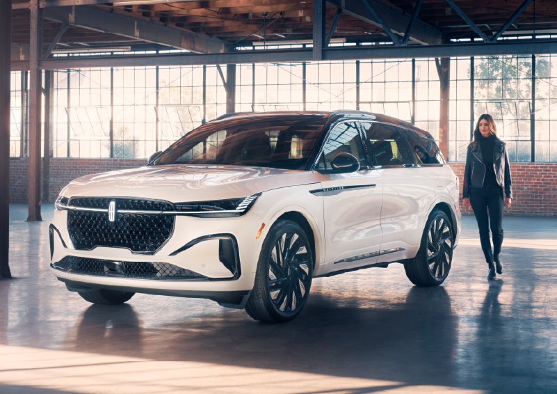 A person approaches a 2026 Lincoln Nautilus® SUV. | Parks Lincoln of Gainesville in Gainesville FL