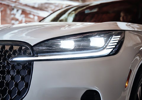 A close-up of a headlamp on the 2027 Lincoln Aviator® SUV is shown. | Parks Lincoln of Gainesville in Gainesville FL