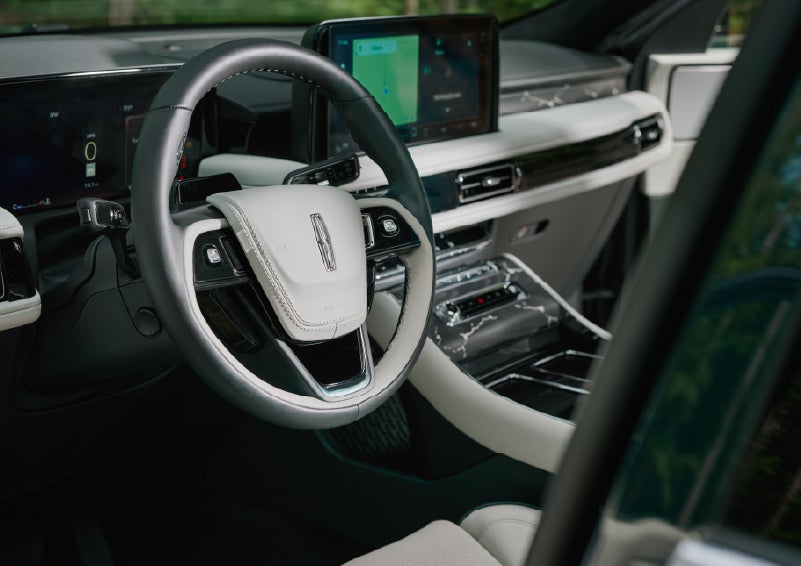 The leather-trimmed steering wheel of a 2027 Lincoln Aviator® Black Label™ SUV. | Parks Lincoln of Gainesville in Gainesville FL
