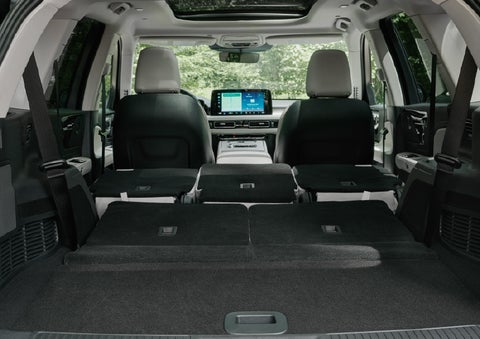 A rear to front view of the interior of a 2027 Lincoln Aviator® Black Label™ SUV shows the third and second rows folded flat | Parks Lincoln of Gainesville in Gainesville FL
